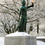 Torch statue in winter with snow