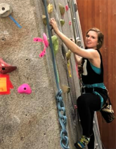 Elizabeth Molinet rock climbs.